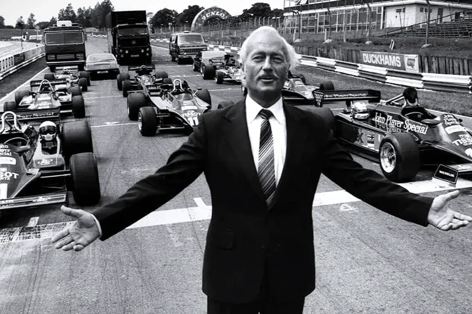 Colin Chapman with his Lotus Formula 1 cars (Image via Pirelli.com)