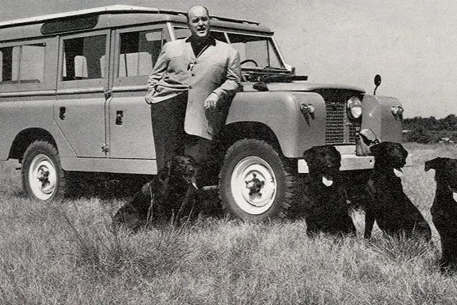 Maurice Wilks in the late 1950s, in front of a Land Rover Series I (Image via Pinterest.com)