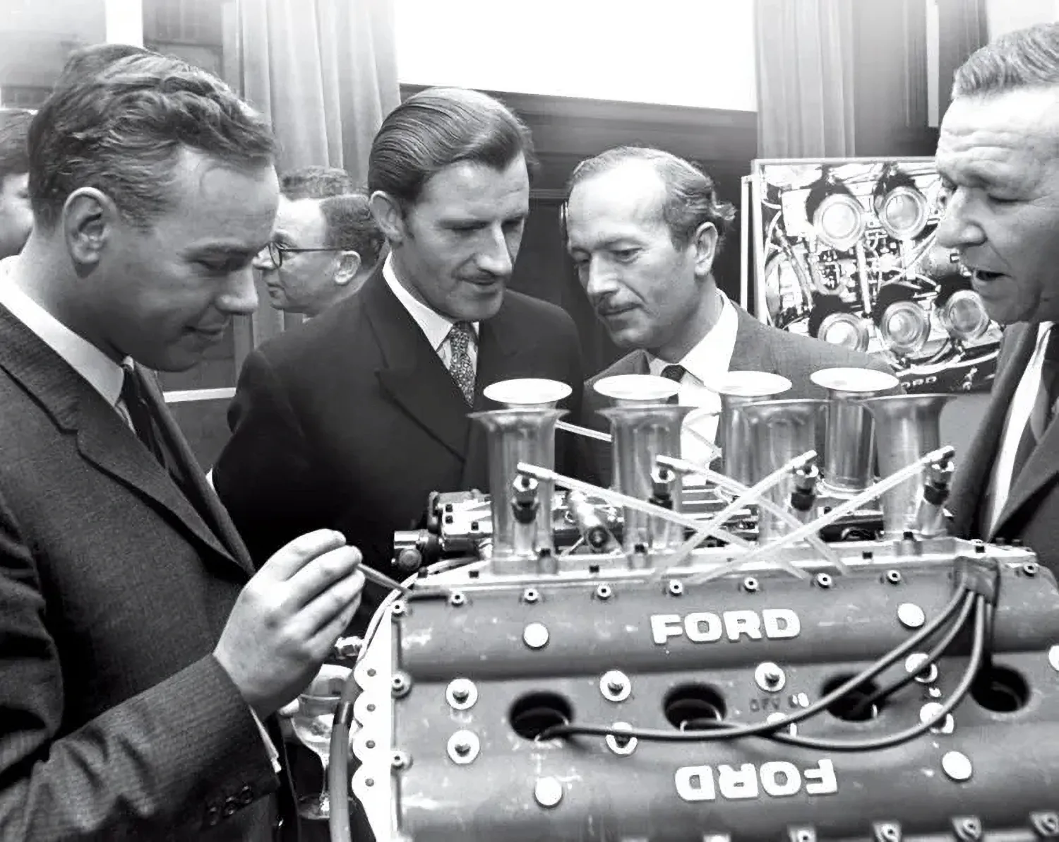 Keith Duckworth, Phil Hill, Colin Chapman and Mike Costin