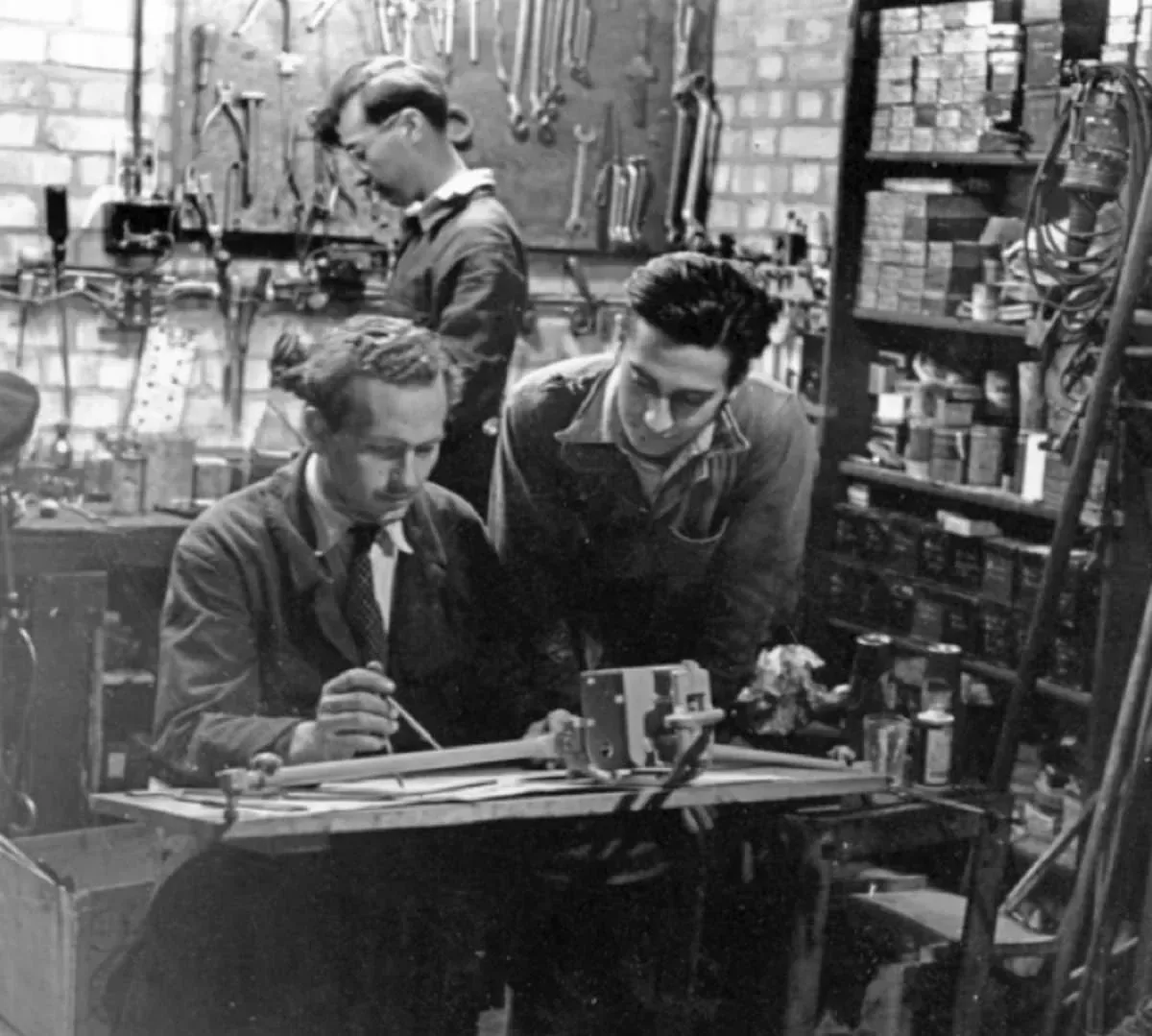 Colin Chapman with Michael and Nigel Allen in their early Lotus workshop